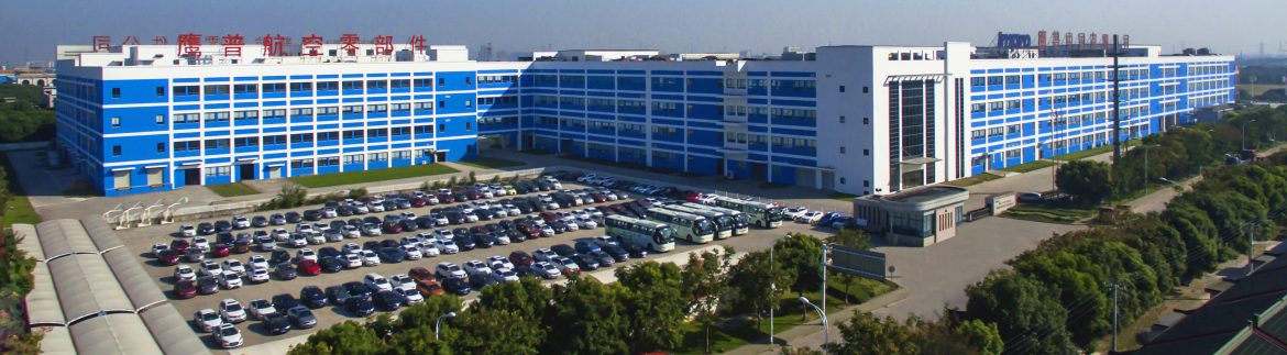 Impro Industries aerial view of their large blue building.