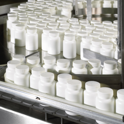 Natural Alternatives International Inc finished bottles on production line.