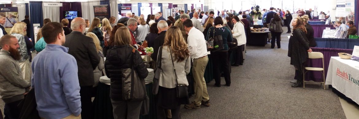 New Hampshire Municipal Association 2018 Annual Conference with a lot of people at different tables talking.