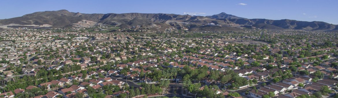 Henderson, Nevada aerial city view with mountains and blue sky in the background.
