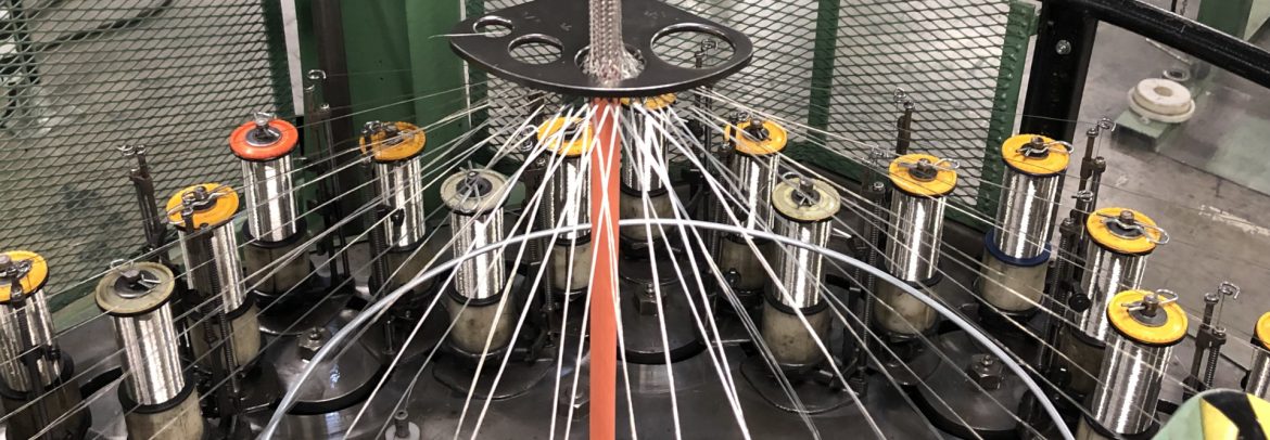 Champlain Cable Corporation braiding machine with cable.
