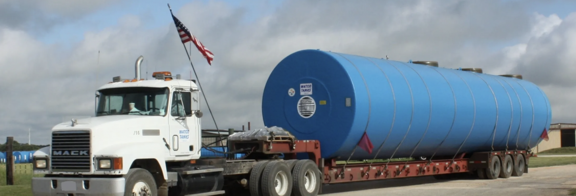 Watco Tanks Inc. Semi Truck with a tank loaded on back.