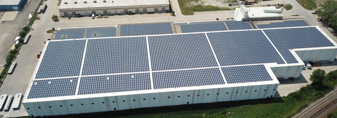 Dukane Precast Aerial building view, solar panels covering roof.